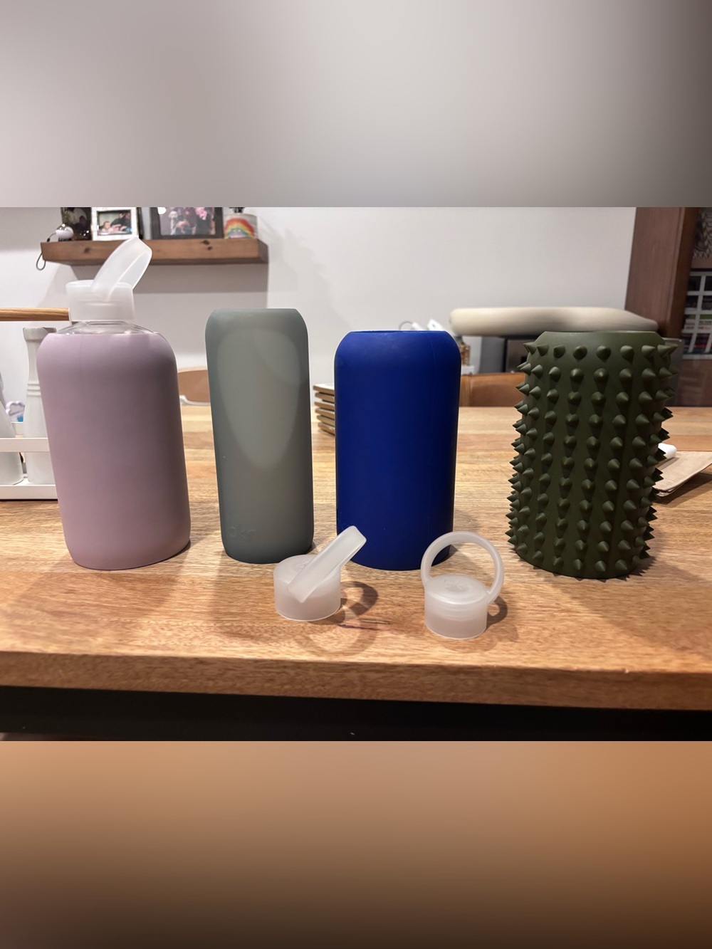 Bkr haul silicone bottle sleeves in cobalt blue and sage green